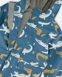 Blue Raincoat With Crocodiles That Change Color Upon Contact With Water Outerwear Deux par Deux 